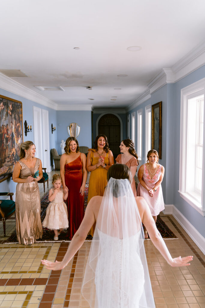 Bride having her dress reveal with her bridesmaids at new college sarasota, Sarasota wedding venue