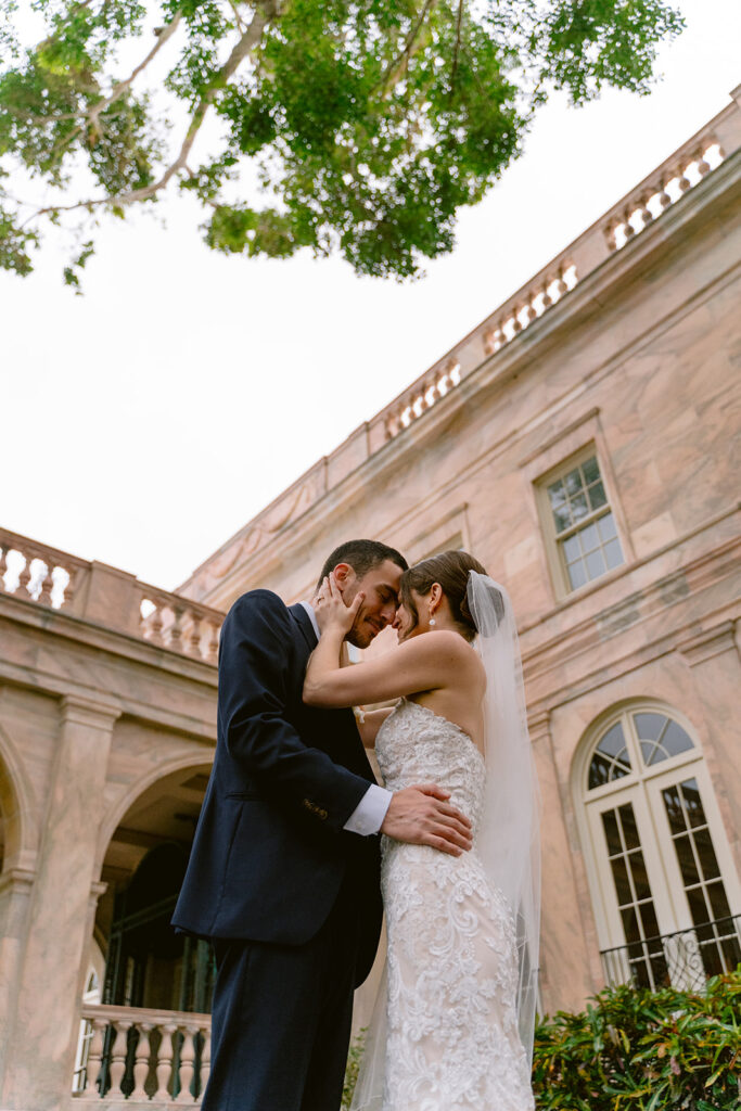 Bride and groom putting their heads together at their sarasota wedding at New College